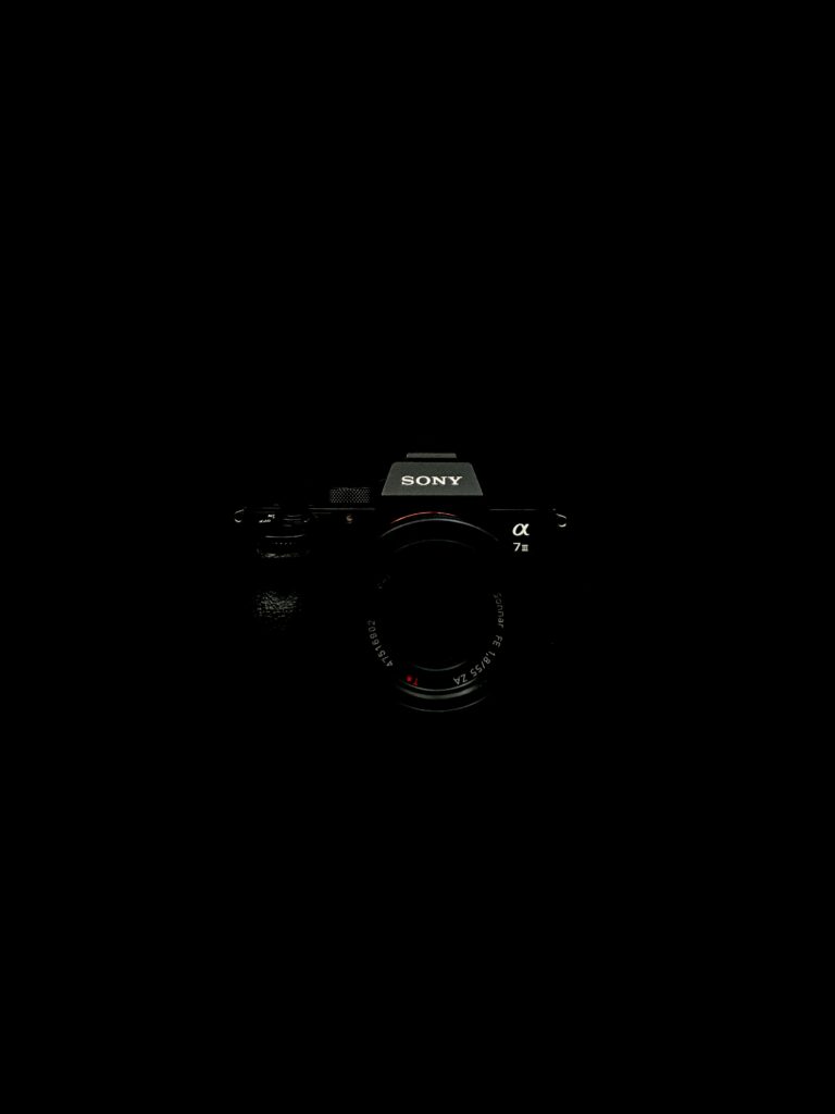 Minimalist Sony Alpha 7II Wallpaper: Sleek Design on Black Background