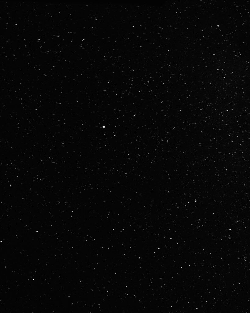 Cosmic Minimalist Wallpaper: Vast Starry Space on Black Background