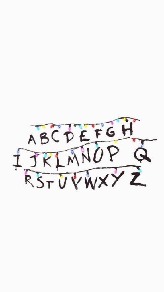 Minimalist Stranger Things wallpaper with Hawkins alphabet wall and colorful Christmas lights