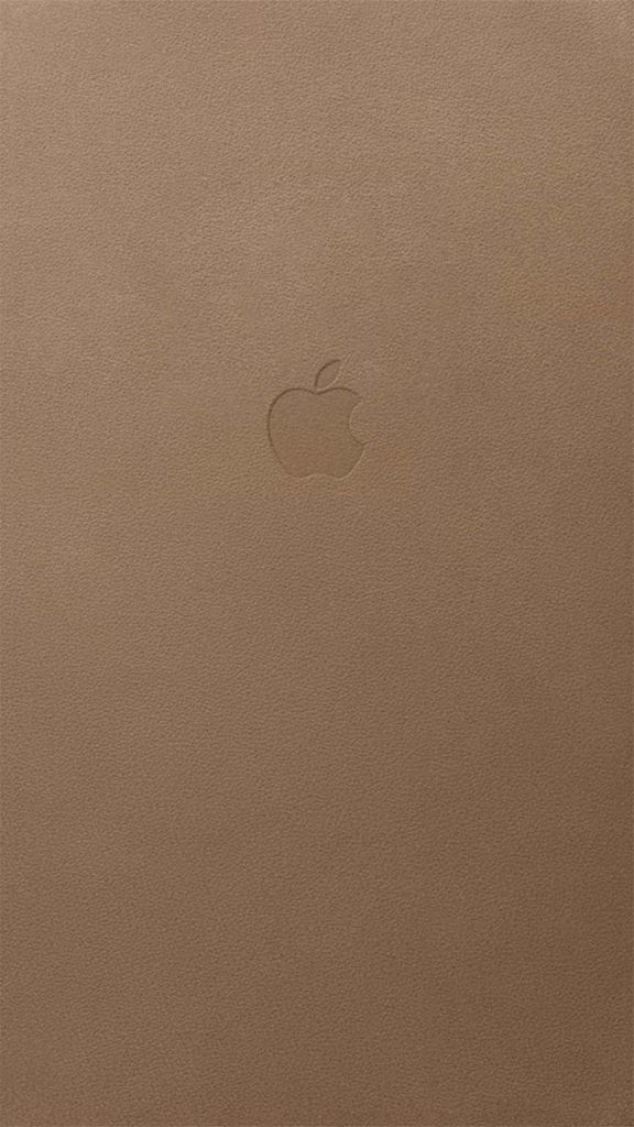 Minimalist tan leather texture wallpaper with centered Apple logo in earth-tone palette background