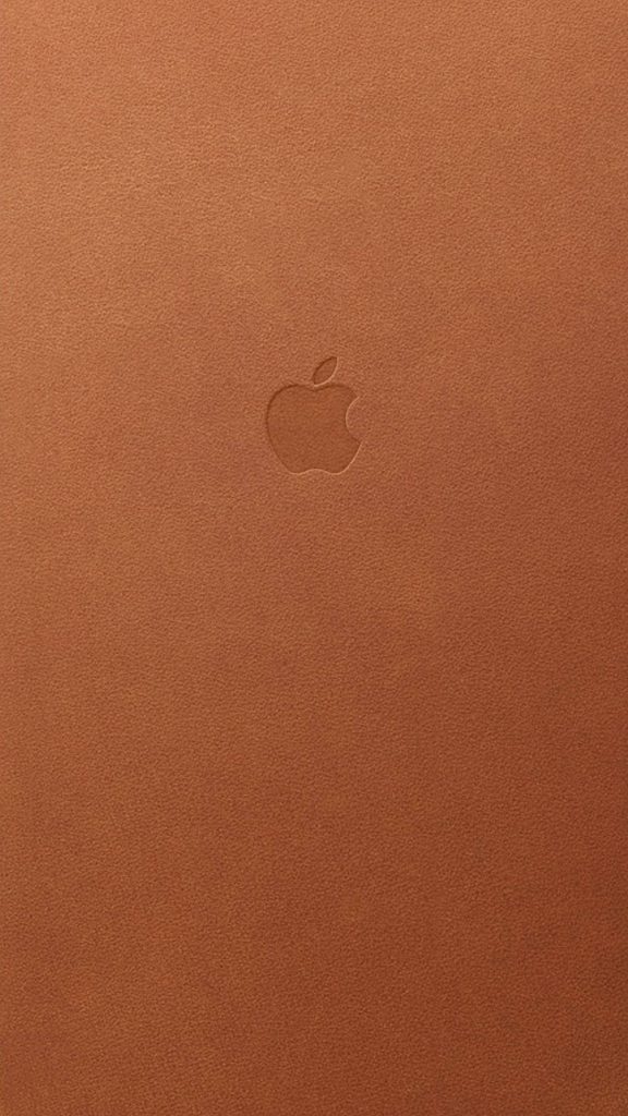Minimalist tan leather iPhone wallpaper with embossed Apple logo elegant textured background