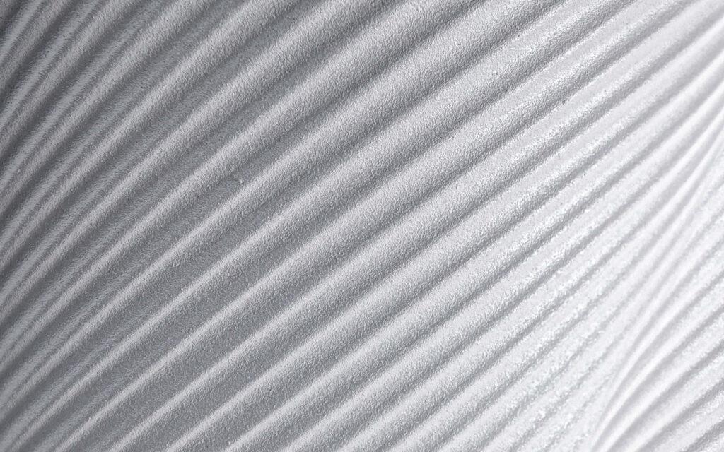 Minimalist Textured Wallpaper with Wavy Lines on White Background