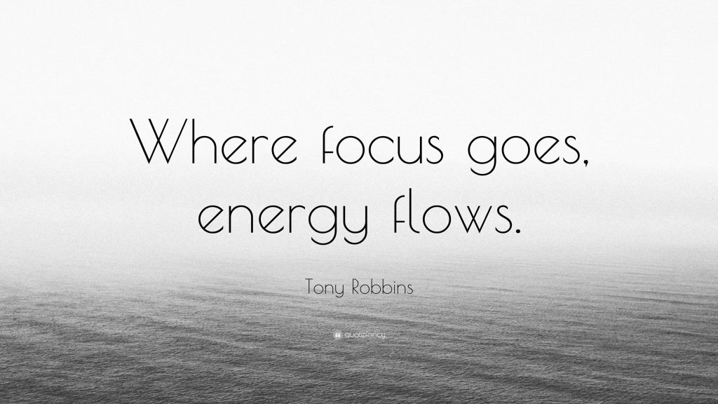 Minimalist wallpaper with Tony Robbins quote over misty ocean background for motivation and focus