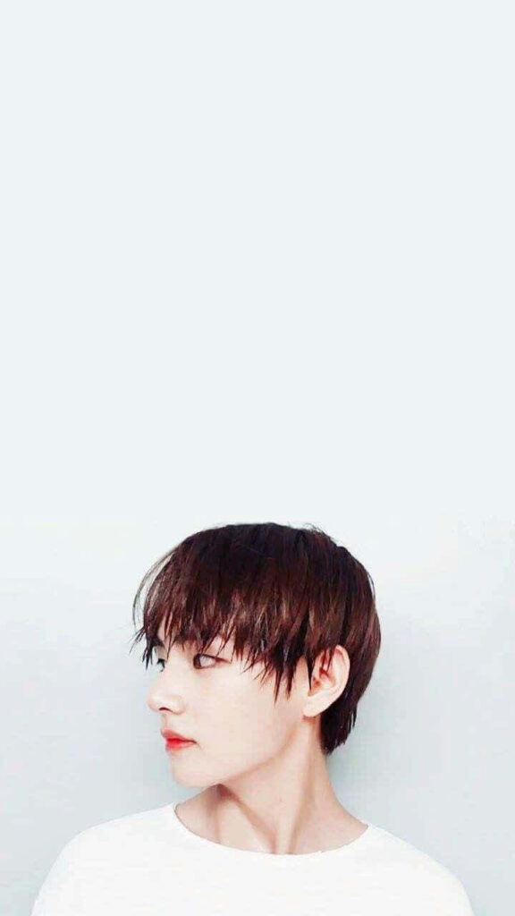 Minimalist side view wallpaper of BTS V in white shirt with light background for phone display