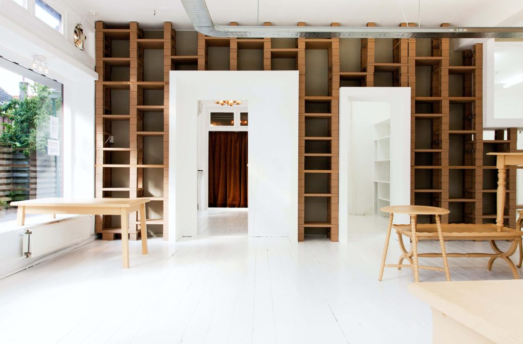 Minimalist virtual background with bright room cardboard shelves white floors wood furniture for Zoom Wallpaper