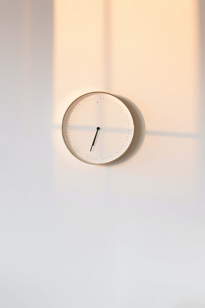Minimalist Wall Clock Wallpaper: Serene Neutral Background Design