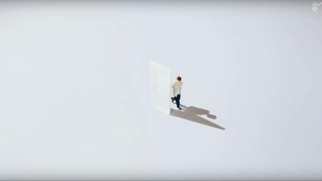 Minimalist Boy Casting Long Shadow on White Background Wallpaper