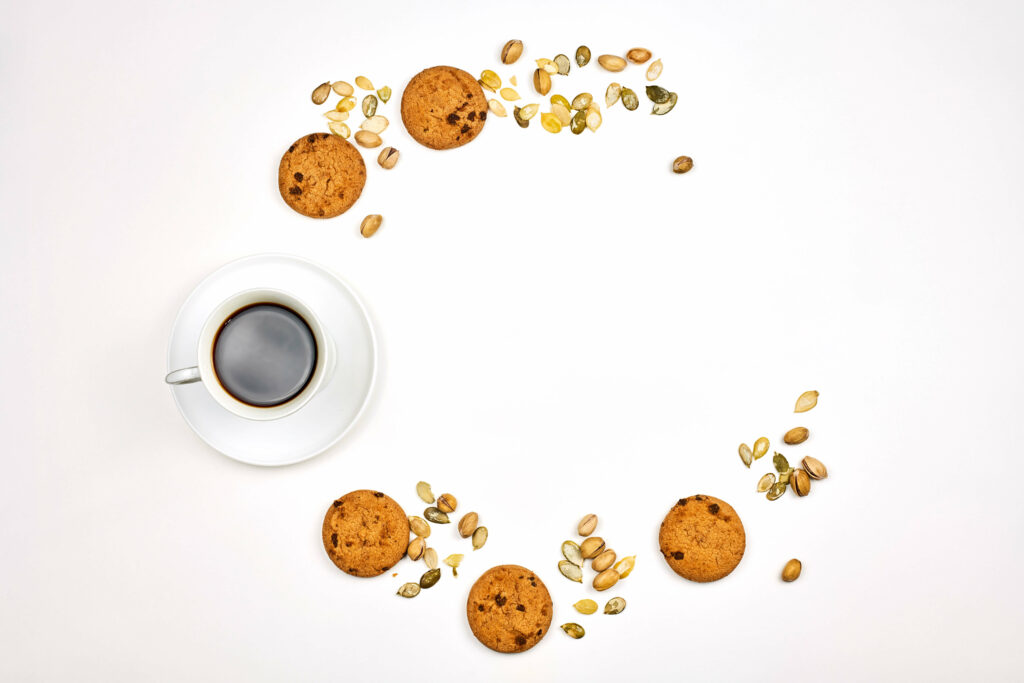 Minimalist Coffee Wallpaper with Cookies & Seeds on White Background