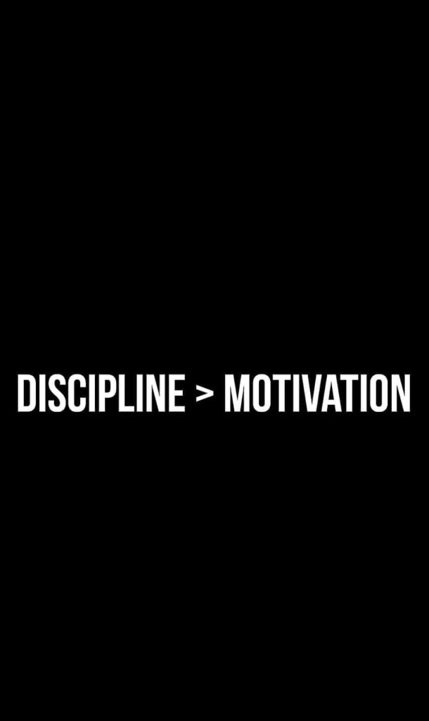 Minimalist Black Wallpaper: Discipline > Motivation for Growth