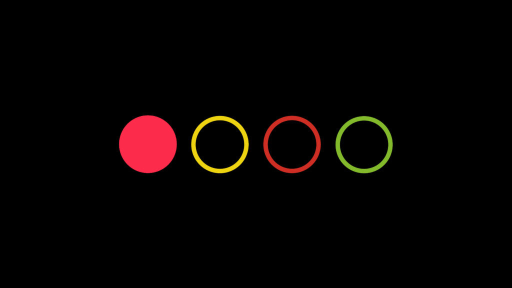 Minimalist Wallpaper: Four Colorful Circles on Black Background