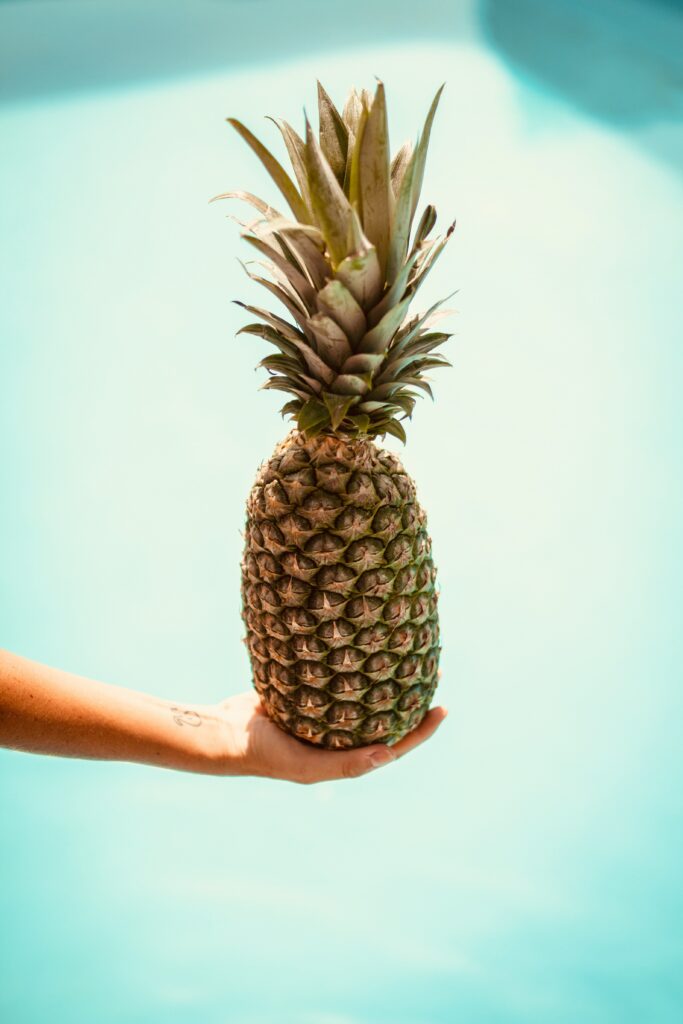 Minimalist Pineapple Wallpaper: Fresh Tropical Vibes on Blue Background