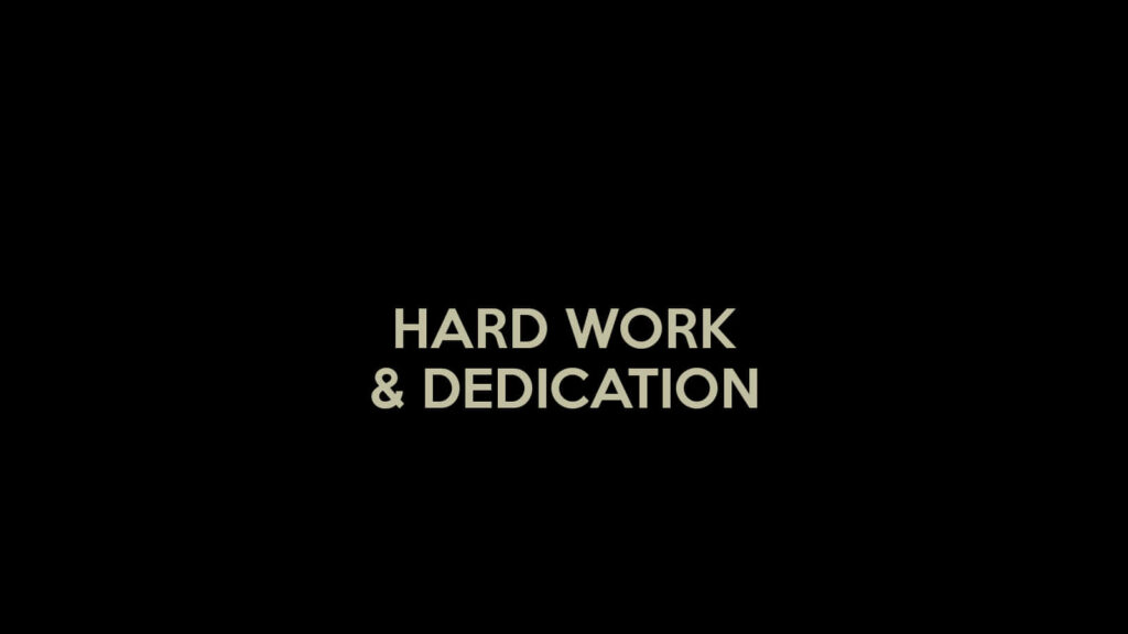 Minimalist Wallpaper: 'Hard Work & Dedication' on Dark Background