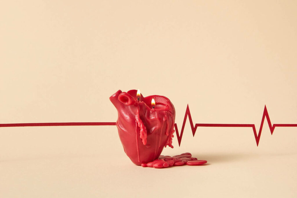 Minimalist Wallpaper: Red Heart Candle on Beige with Heartbeat Line