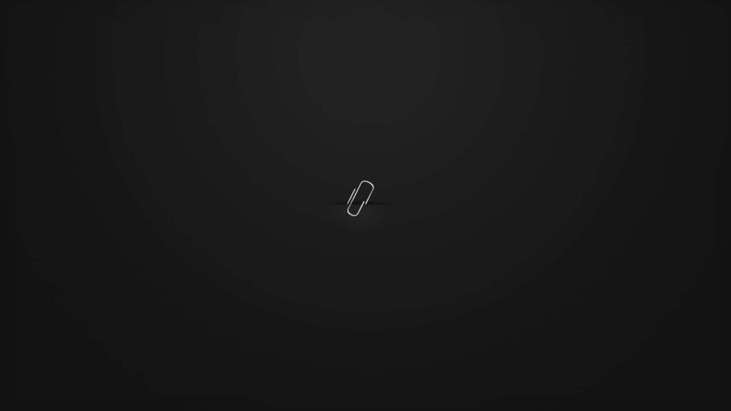 Minimalist Wallpaper: Silver Paper Clip on Dark Black Background