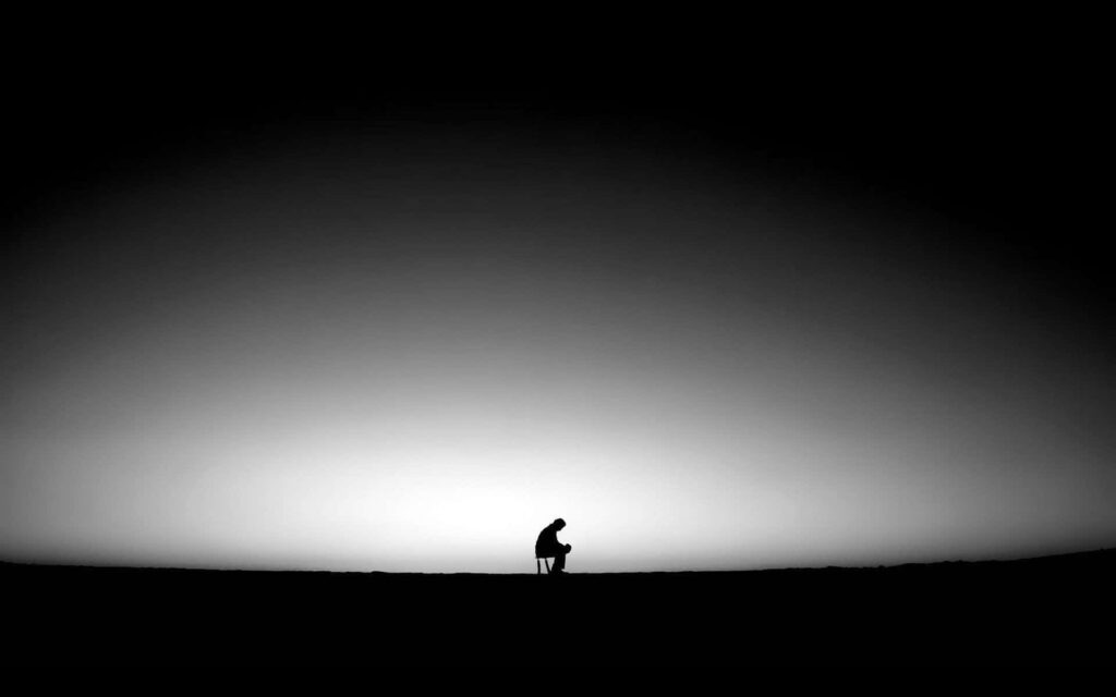 Minimalist Solitary Figure Wallpaper: Dark Gradient Background