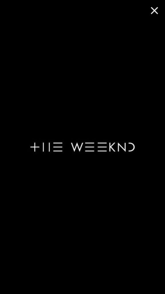 Minimalist Wallpaper: The Weeknd's Iconic Logo on Black Background