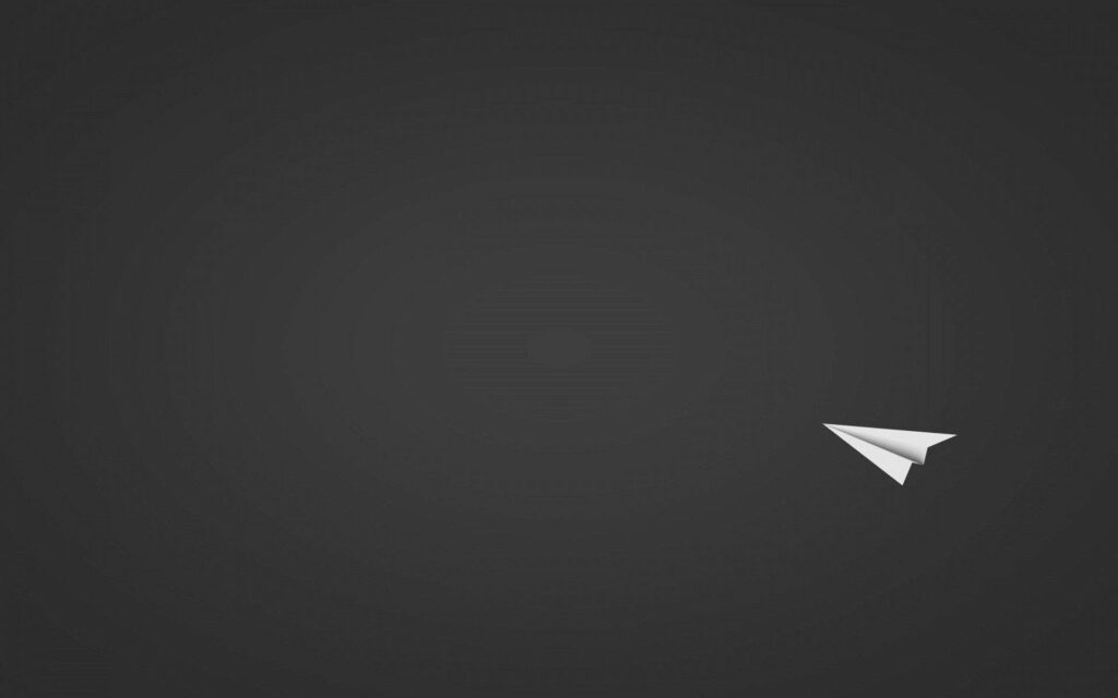 Minimalist Dark Wallpaper: White Paper Plane on Deep Gray Background