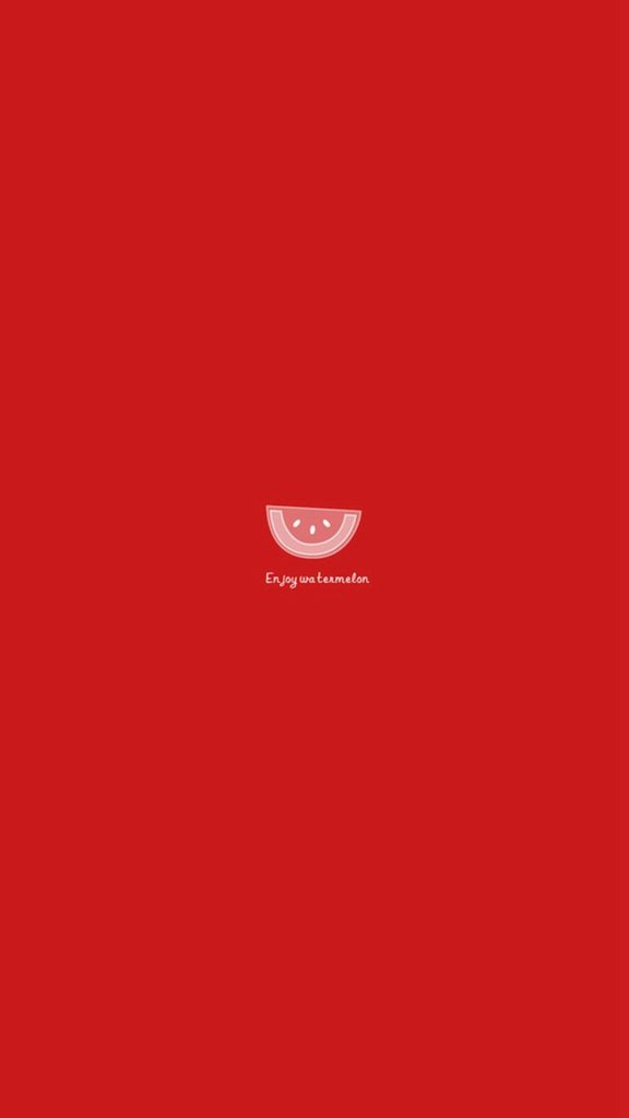 Minimalist watermelon slice wallpaper on bold red background with playful enjoy watermelon text
