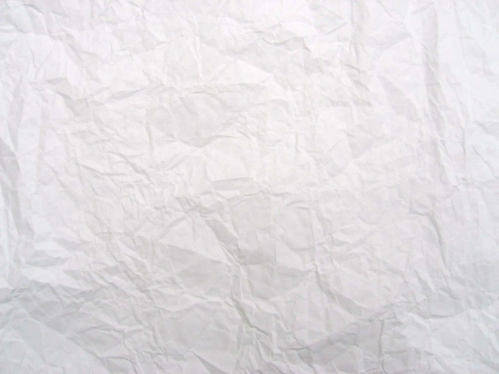 Minimalist crumpled white paper wallpaper with soft shadows and intricate crease texture background