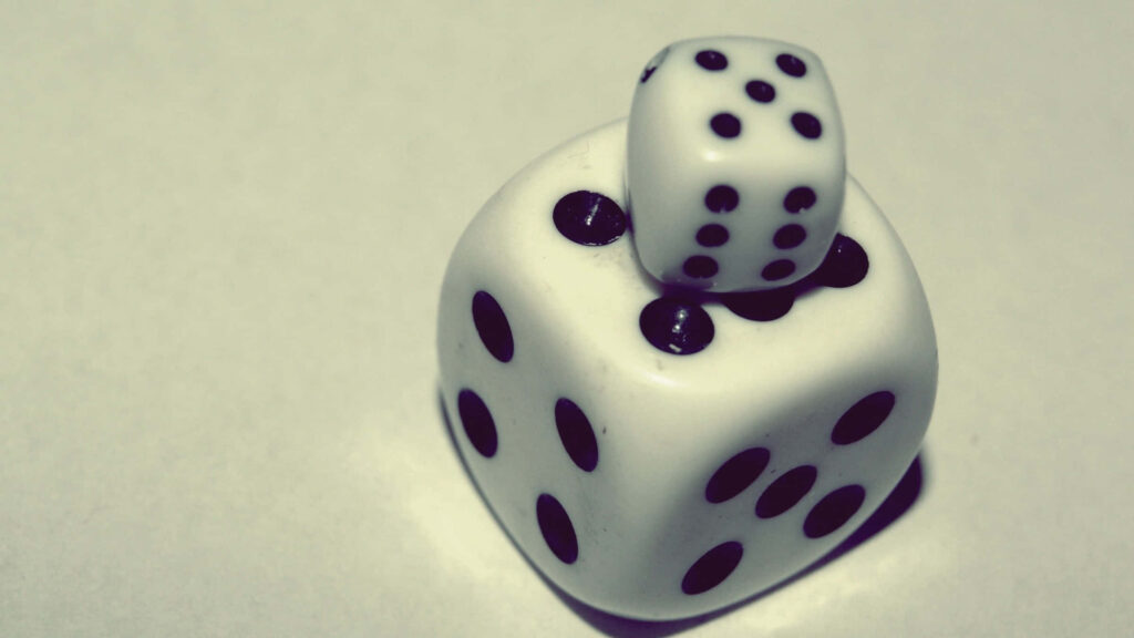 Minimalist wallpaper with two stacked white dice black pips on soft neutral background luck chance