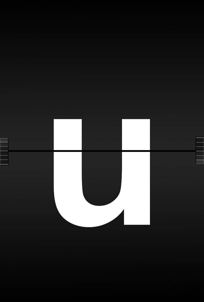 Minimalist white lowercase u digital wallpaper styled as mechanical split-flap airport display board
