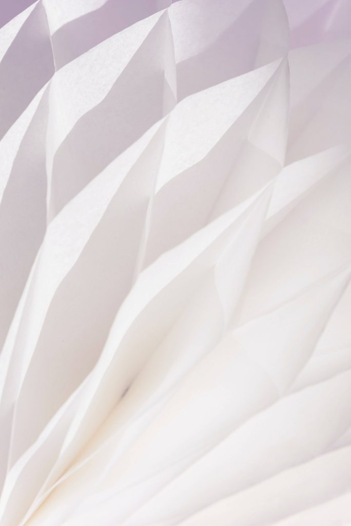 Abstract white paper folds wallpaper minimalist geometric pleats soft lighting background