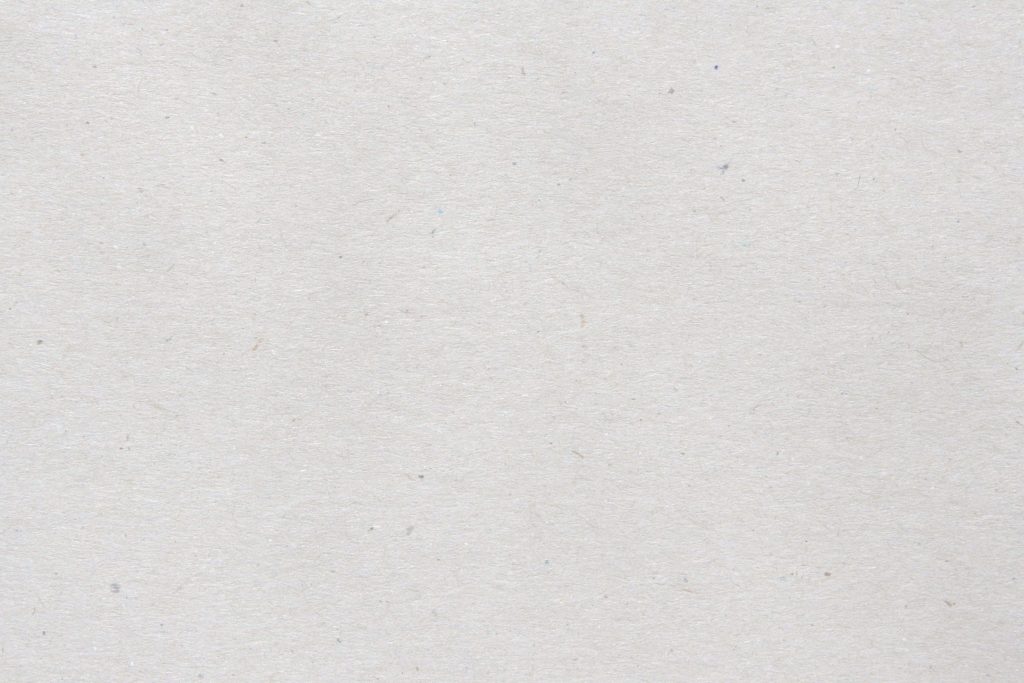 Minimalist white paper texture with organic fiber flecks neutral natural abstract wallpaper background