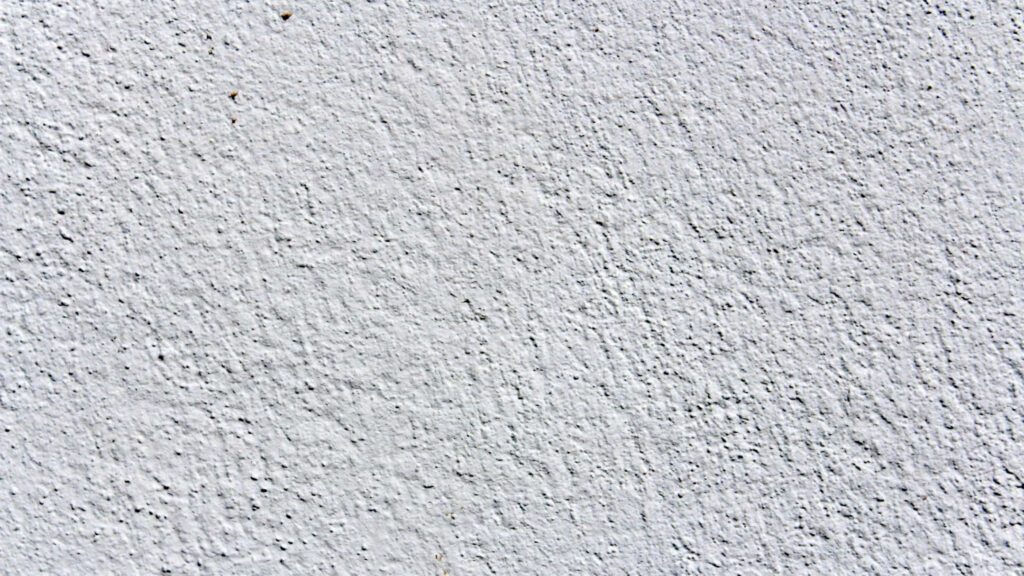 Minimalist White Wall: Smooth Textured Wallpaper Background