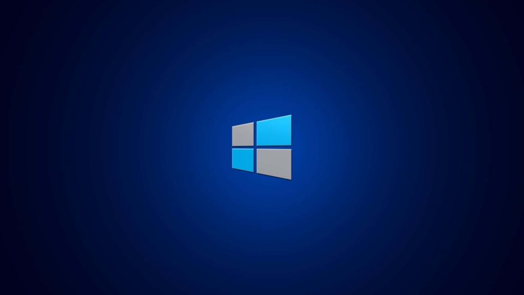 Minimalist Windows logo centered on deep blue radial gradient background for desktop wallpaper