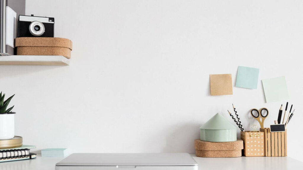 Streamlined Serenity: A Zoom Office Oasis Featuring a Sleek Workspace, Camera, and Organized Pen Holder Wallpaper