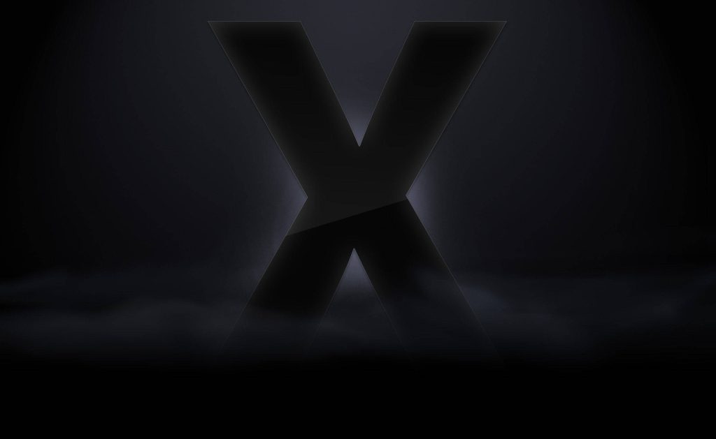 Minimalist X logo wallpaper with dark foggy background sleek modern digital art desktop