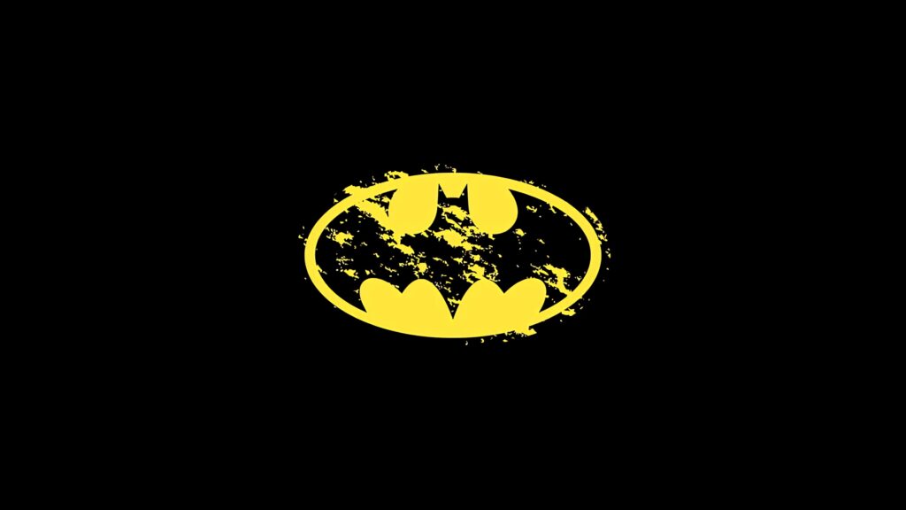 Minimalist yellow Batman logo splatter on black background digital art wallpaper design