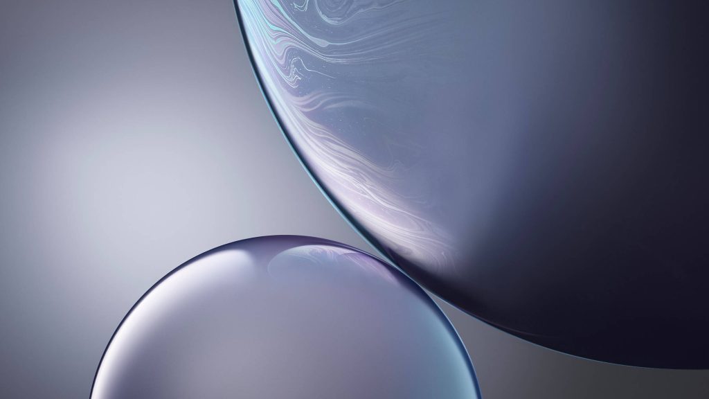 Minimalist iPhone XR wallpaper with abstract blue and purple iridescent fluid spheres design
