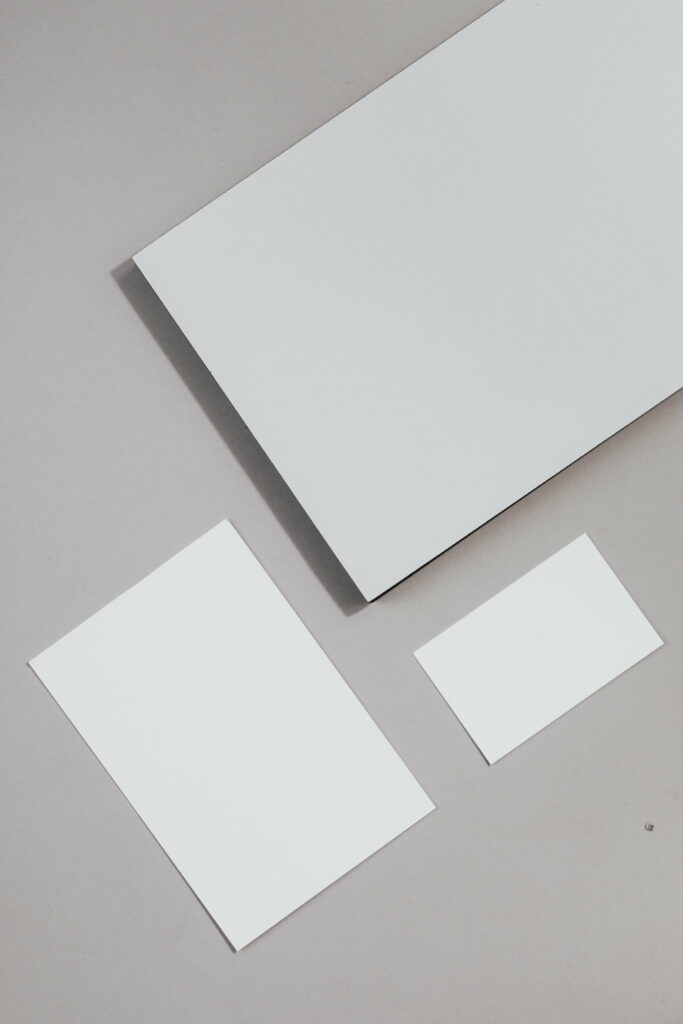Contrasting Textures: Minimalist 4K Wallpaper featuring White Printer Paper on a Rich Brown Surface