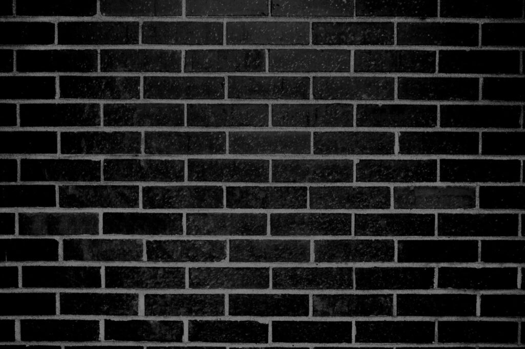 Minimalistic Black Brick Wallpaper Background with Sleek Texture