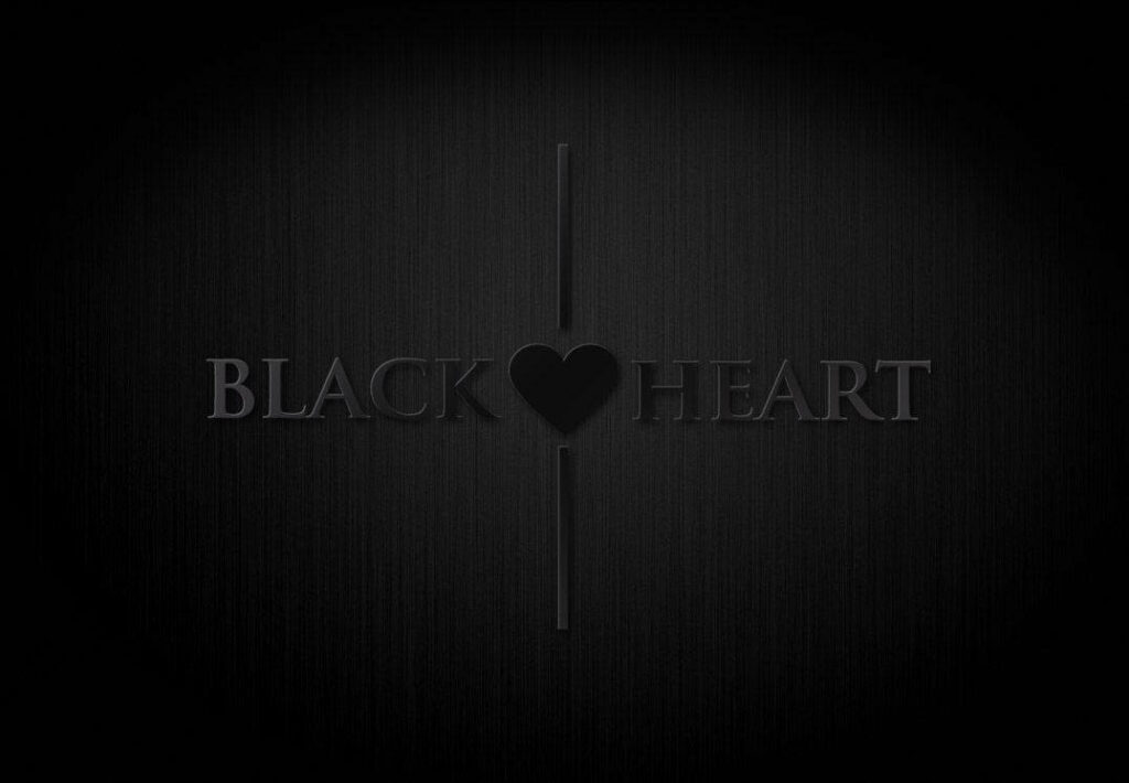 Minimalistic Black Heart Wallpaper: Elegant Textured Background Design