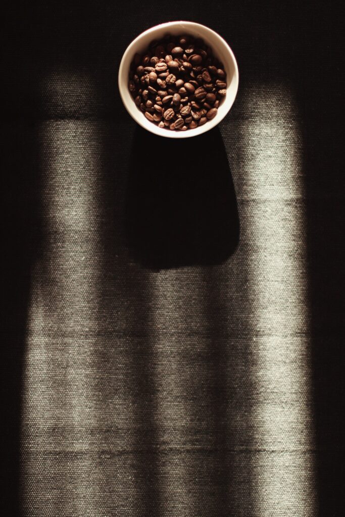 Minimalistic Coffee Beans Wallpaper: Dark Textured Background Art
