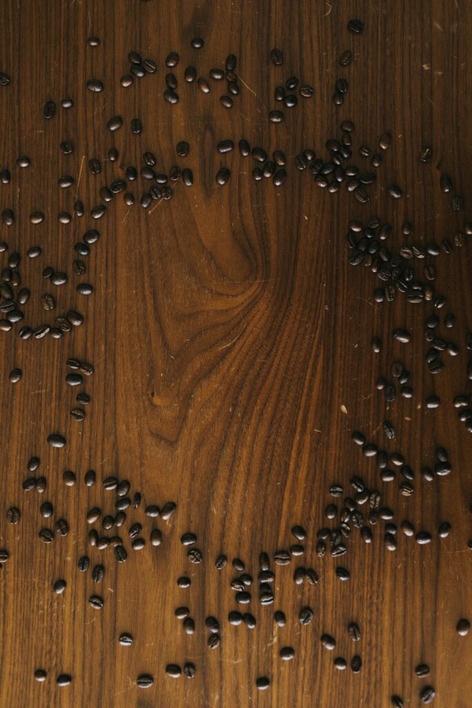 Rustic Coffee Bean Wallpaper: Minimalist Textured Wood Background