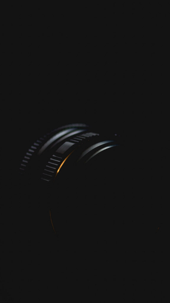 Sleek Dark Phone Wallpaper: 4K Camera Lens with Textures