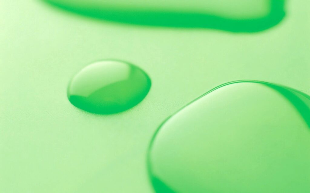 Minimalistic Green Wallpaper with Close-Up Liquid Droplets