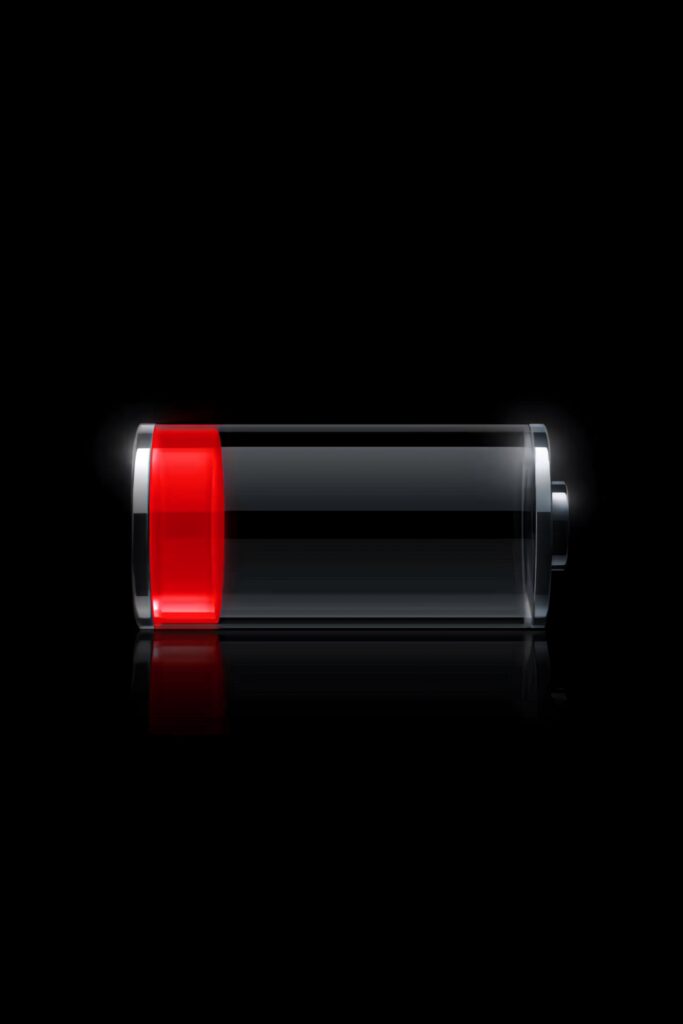 Realistic Low Battery Icon Wallpaper on Black Background