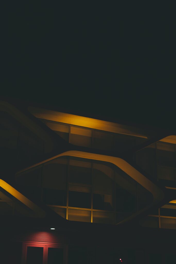 Minimalist Nighttime Building Wallpaper with Atmospheric Lighting