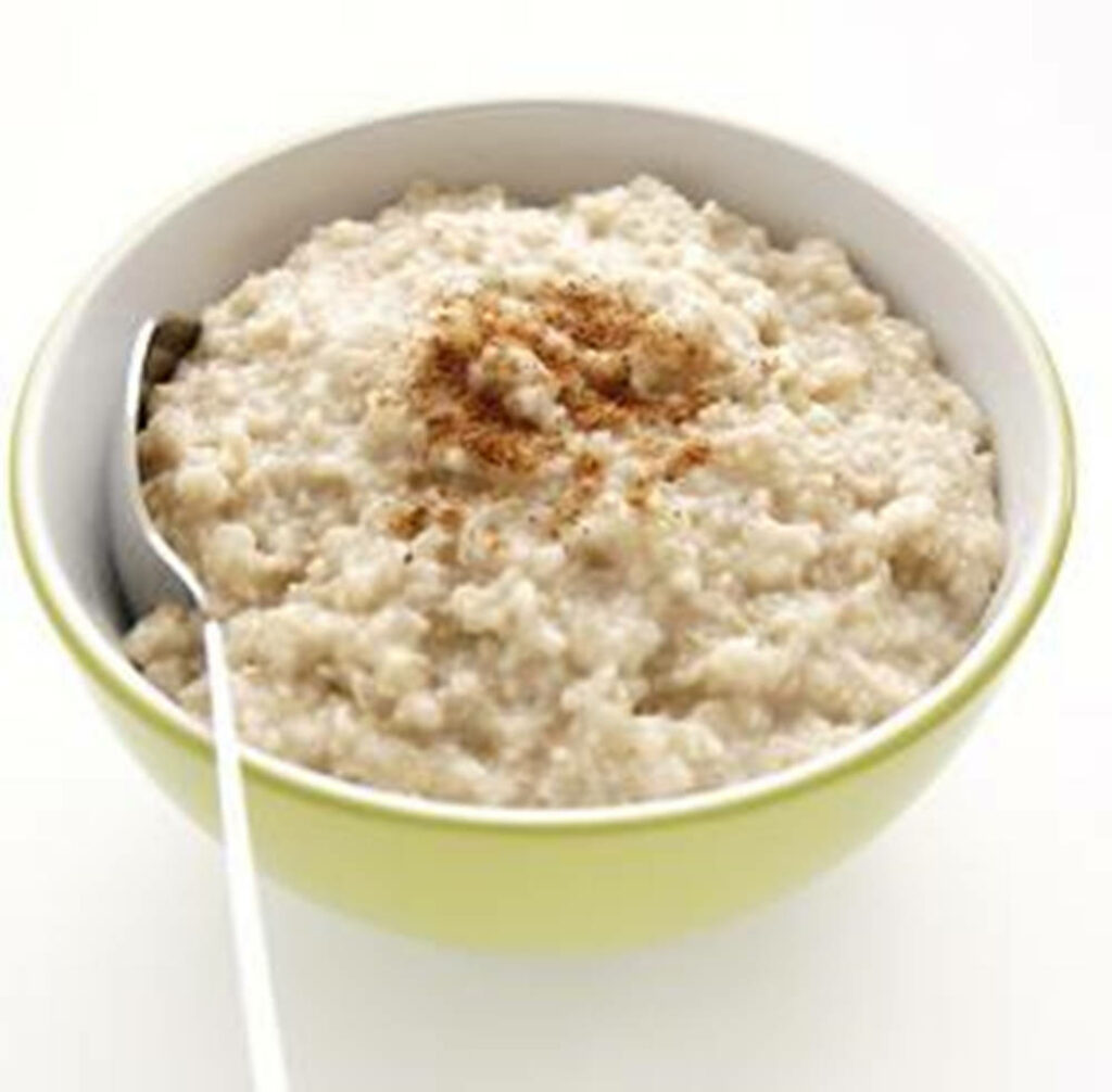 Minimalistic Oatmeal Bowl Wallpaper with Cinnamon - Warm Breakfast Background