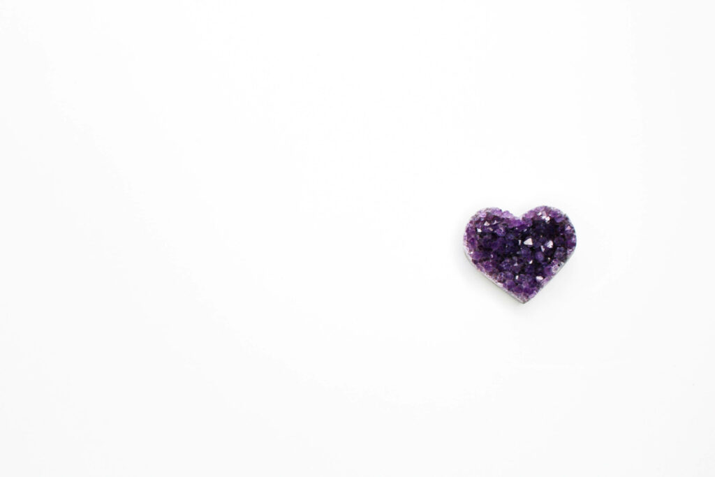 Elegant Purple Crystal Heart Wallpaper on Clean White Background