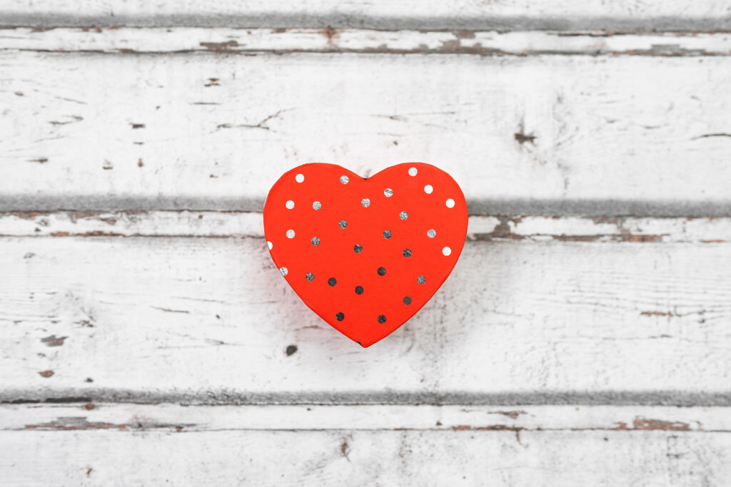 Minimalist Red Heart Box Wallpaper on Rustic White Wood