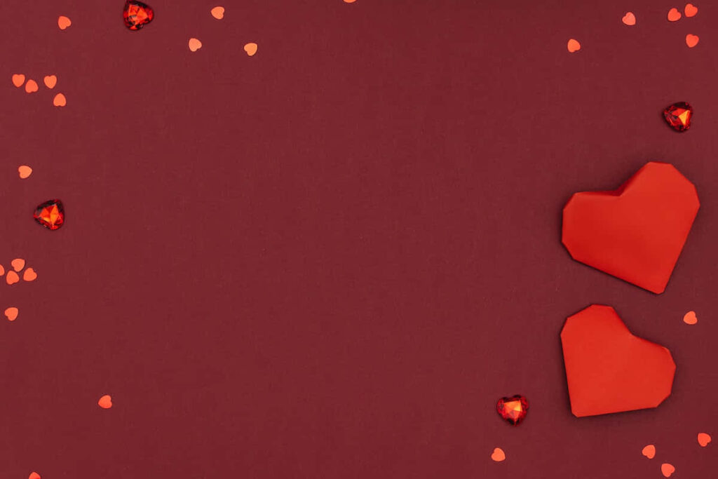 Minimalist Red Wallpaper with Hearts for Valentine's Day Aesthetic