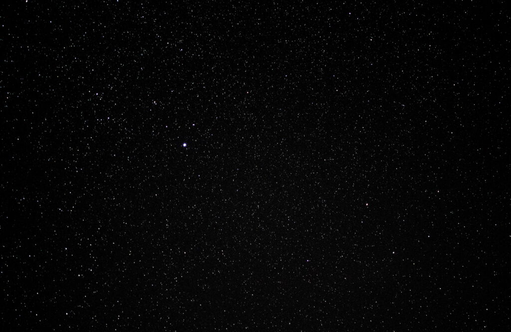 Minimalistic White Stars in the Vast Night Sky: An Astronomy Wallpaper