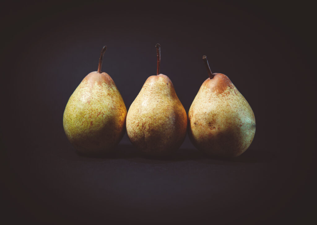 Elegant Minimalist Pear Wallpaper: Dark Setting & Vibrant Colors