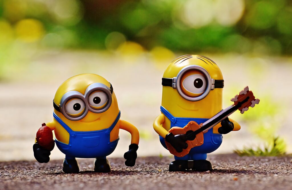 Playful Minions Bob & Stuart Wallpaper: Charming Fun Background