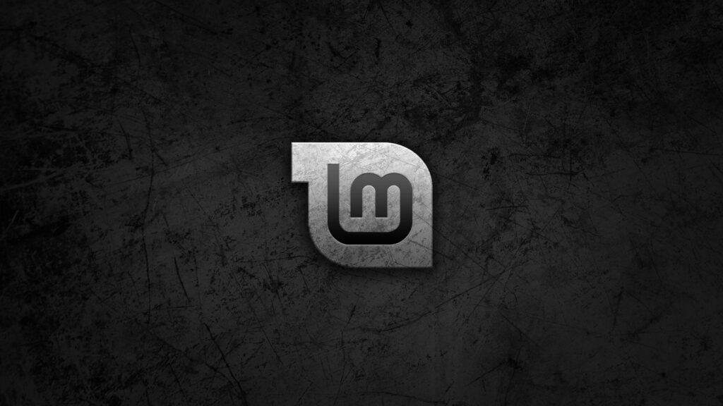 Linux Mint- Embracing the Distinctive Grayscape: A Captivating Logo with Striking Scratches against a Mysterious Black Canvas Wallpaper